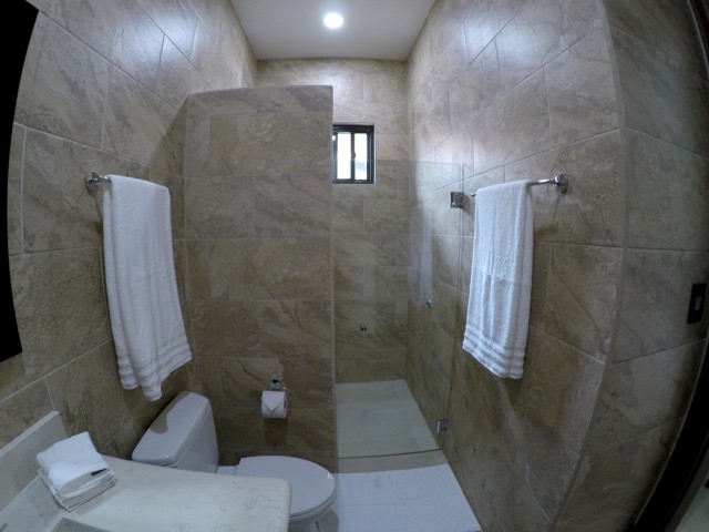 bathroom with shower sink and toliet