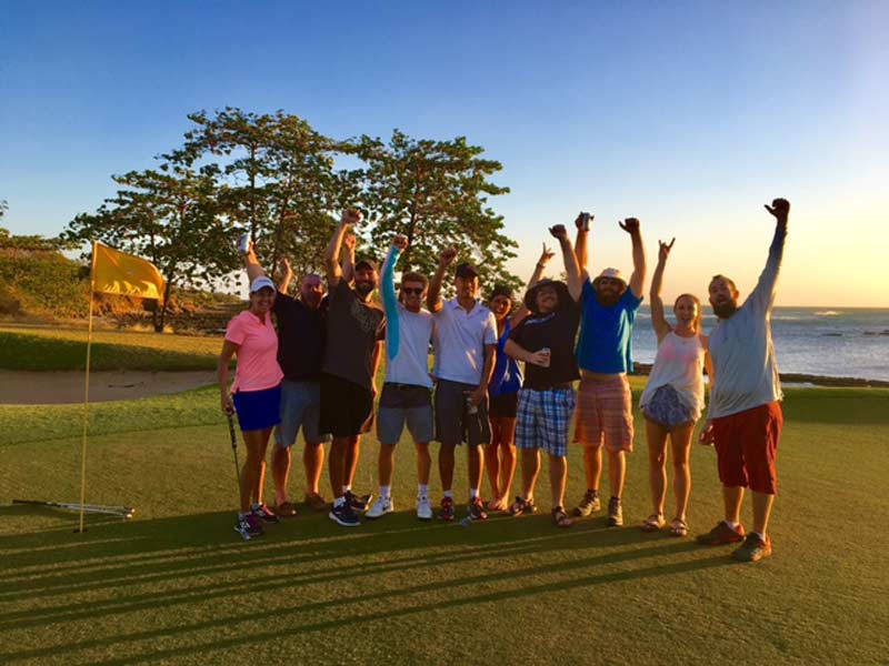 group photo of people golfing
